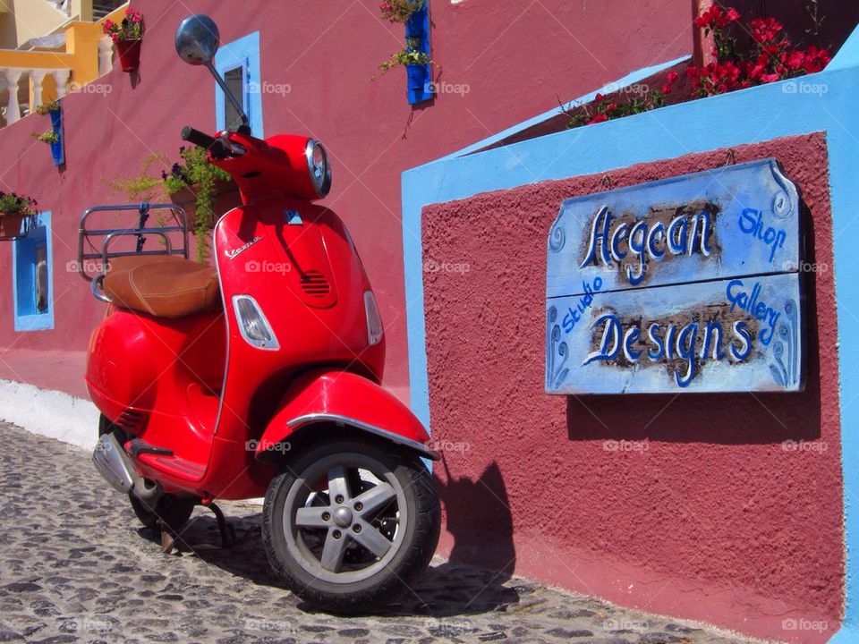 A red vespa in Santorini