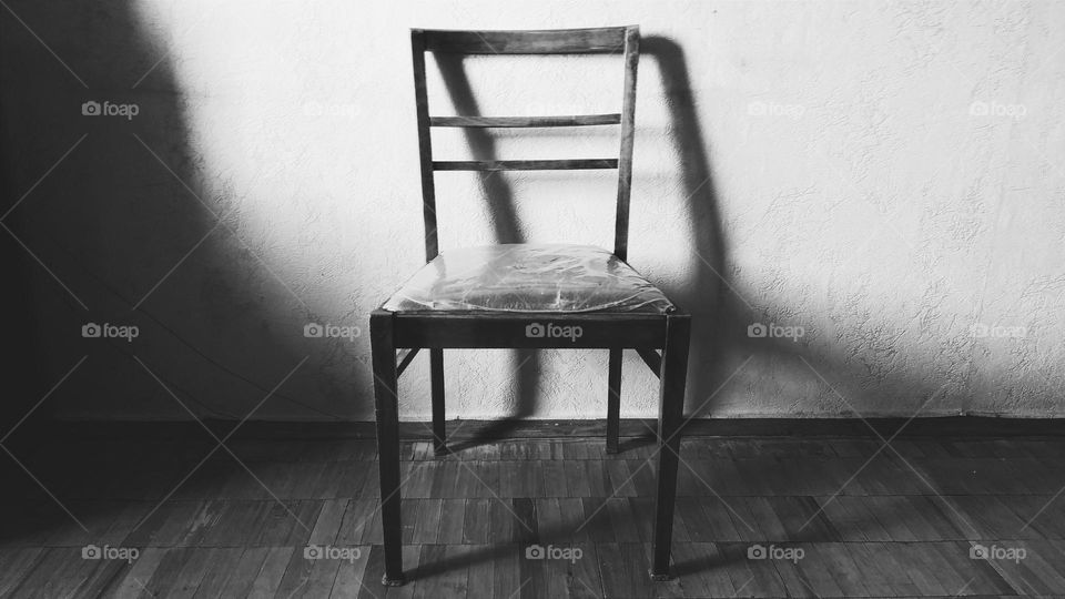 Wooden chair in empty room