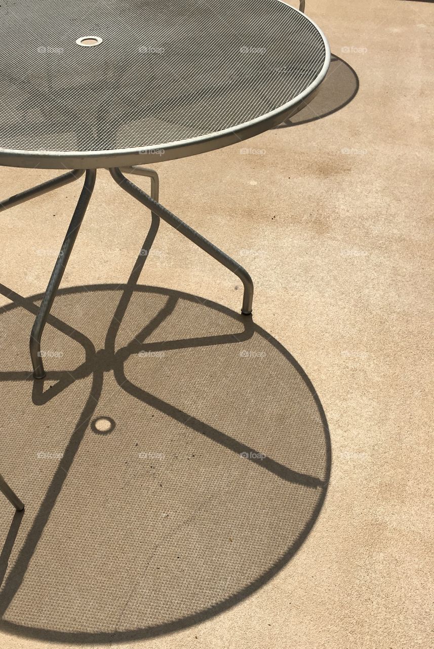 Patio table at work during eclipse.