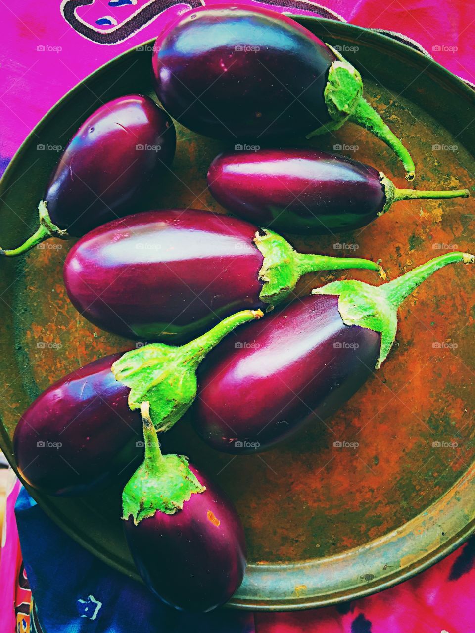 Eggplants on copper surface