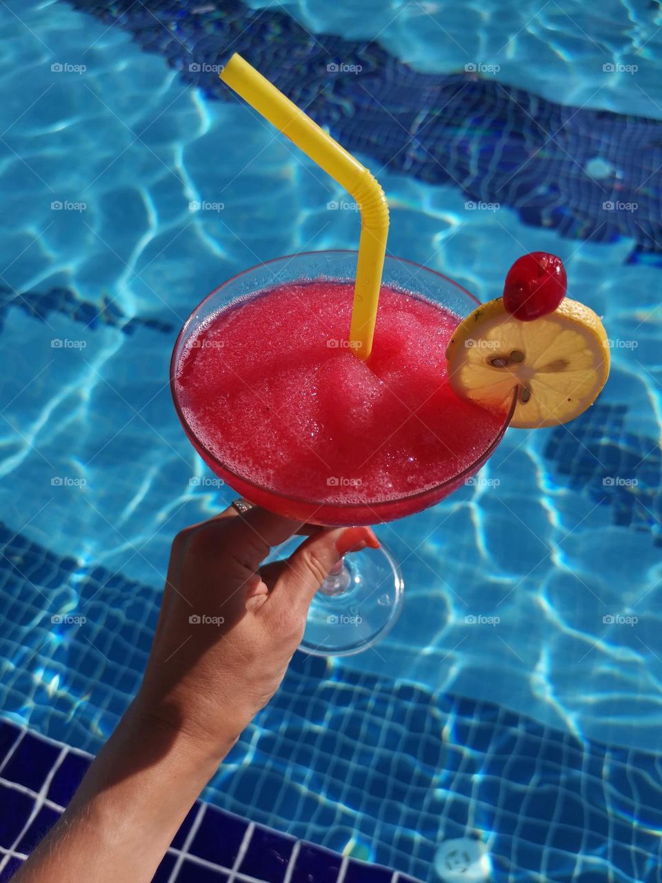 Tasty cocktail and swimming pool. Summer mood. Relax and enjoy your time.