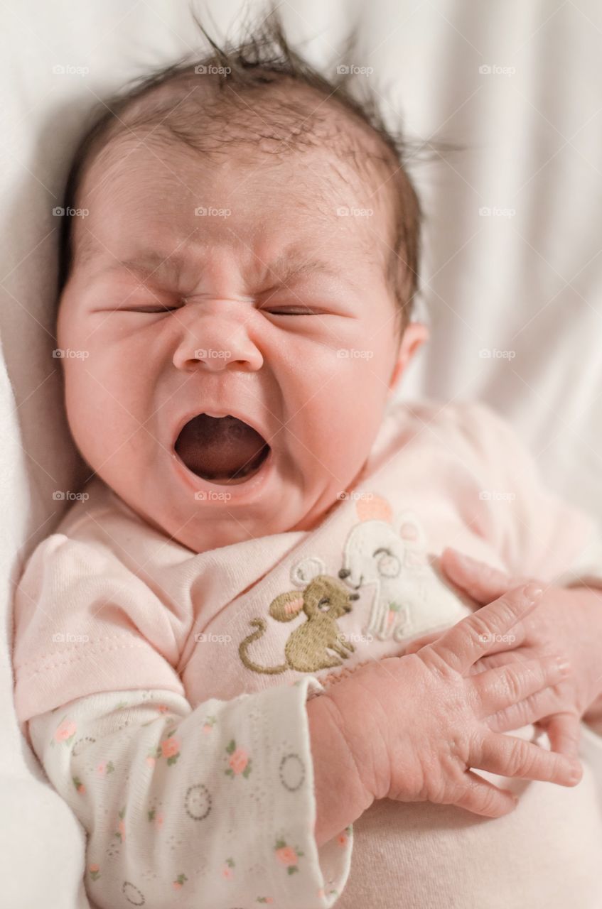 Close-up of a baby yawning