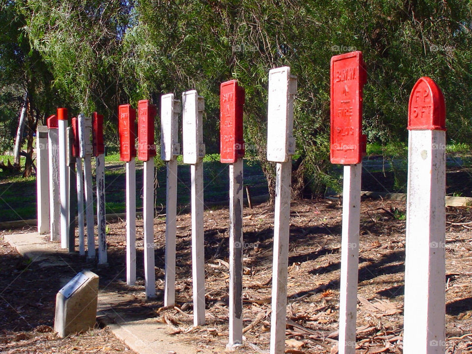 red white fire poles by kshapley