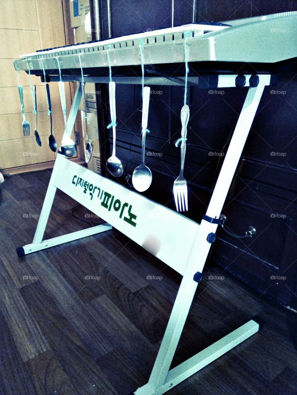 The natural instruments.
spoon taped at the front of piano keys.
aside from playing electric instruments,
hearing the real sound from the real things plus with the piano music on it will make the sound more unique.