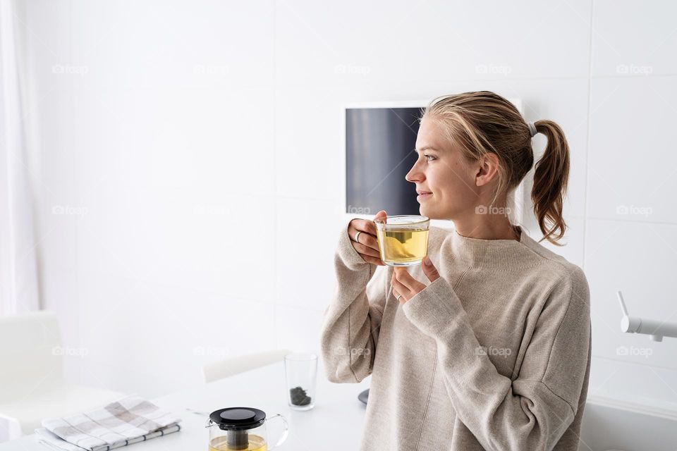 woman drinking tea at home