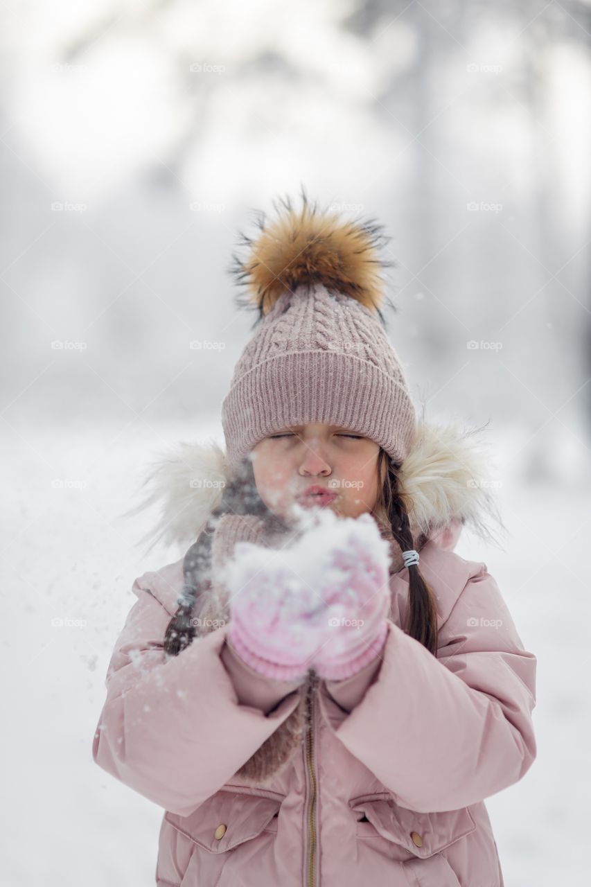 Little girl in a winter park