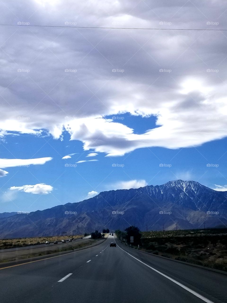 Road Trip II: desert highway with mountains and clouds