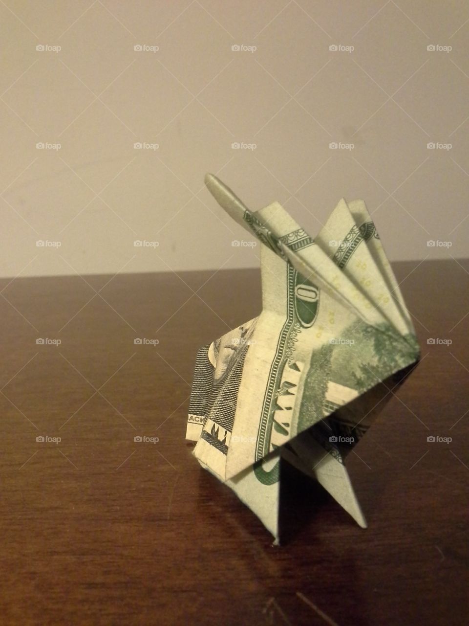 A cute little rabbit made out of a twenty dollar bill