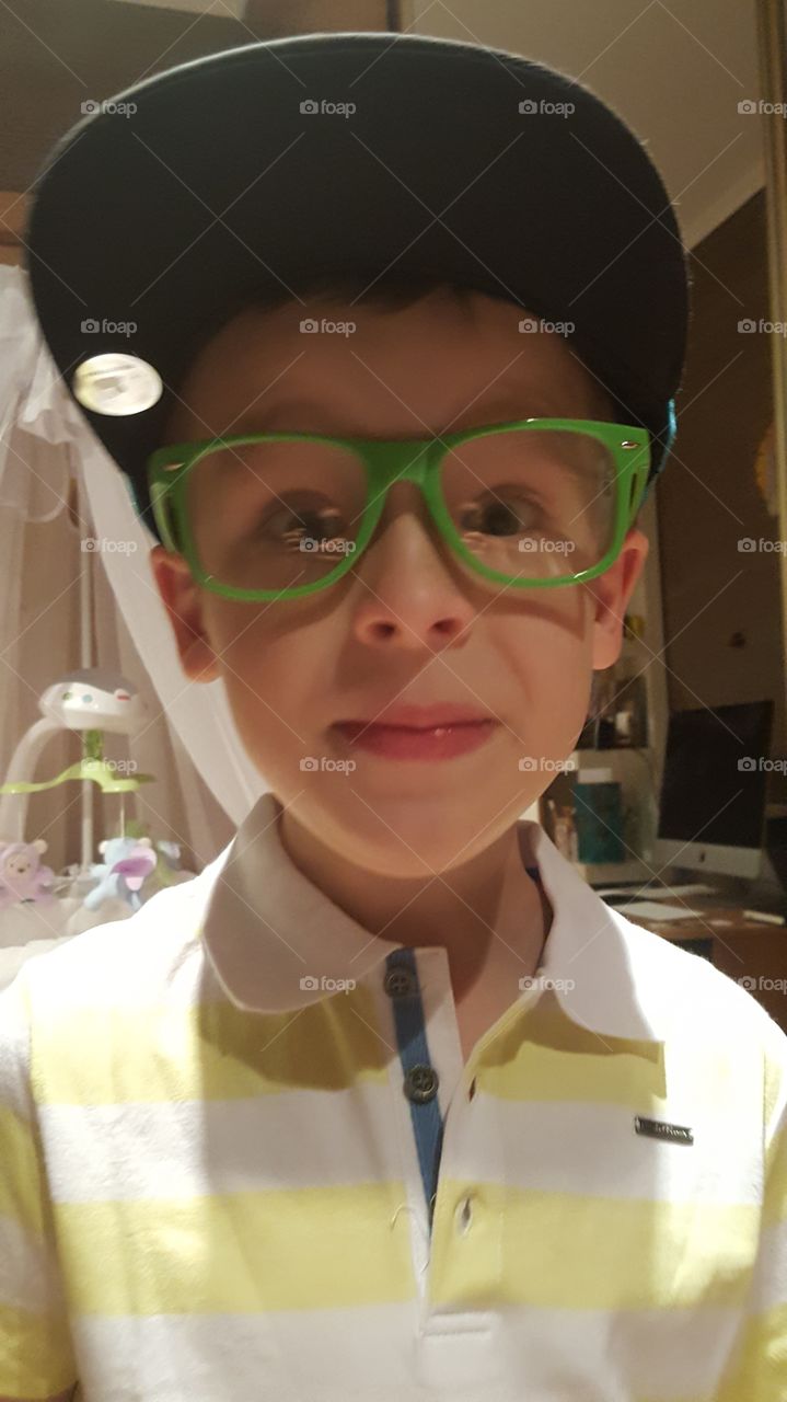 portrait of a boy wearing big glasses