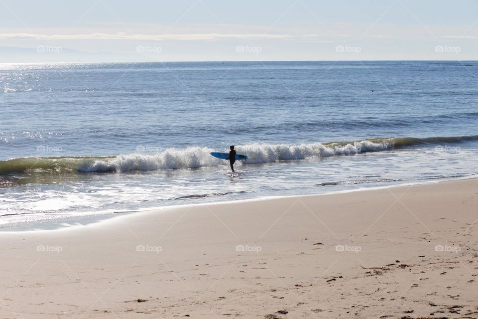 Surfer at Santa Cruz Beach, California 