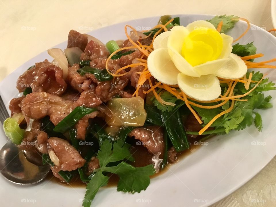 Fried wild boar with spring onions 