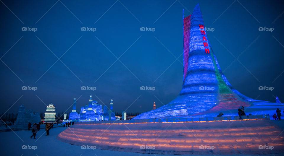 Asia china  Harbin ice Festival snow Festival ice sculptures snow building  snow ice in light colorful ice buildings at night full moon