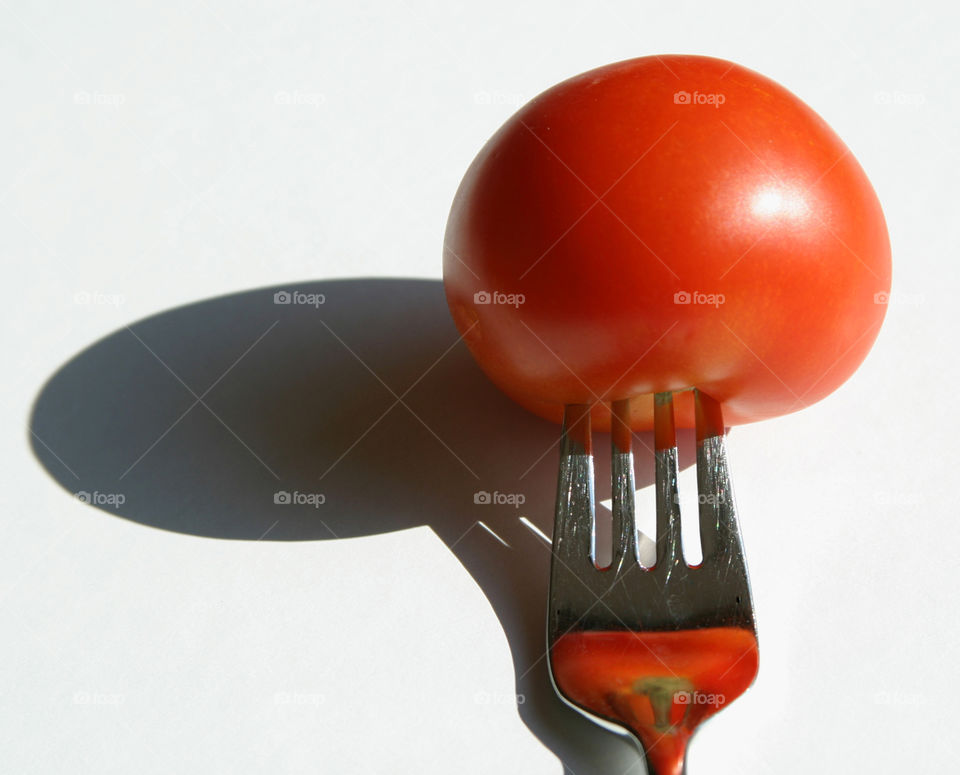 Tomatoe and fork. 