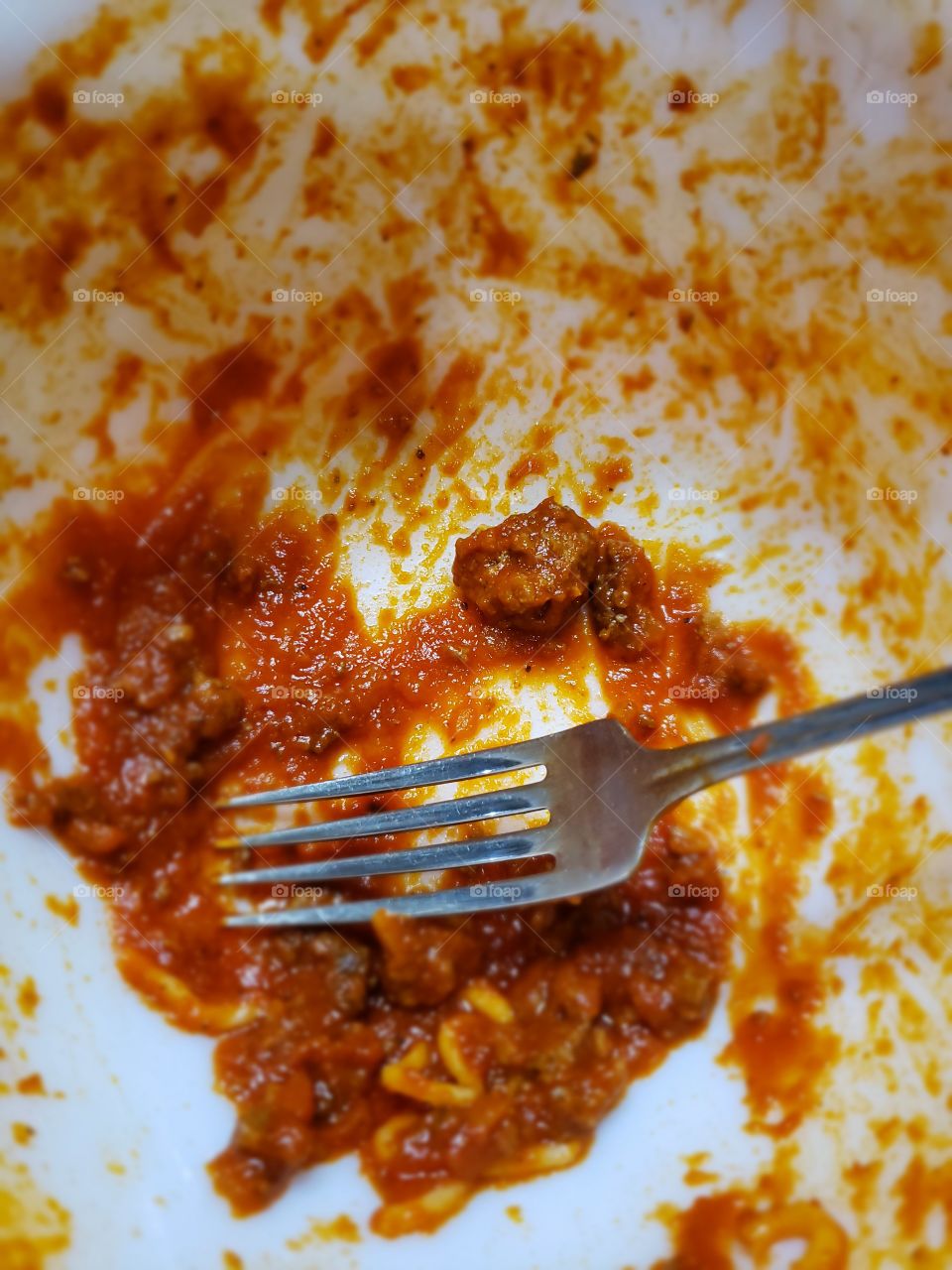 empty spaghetti plate and fork