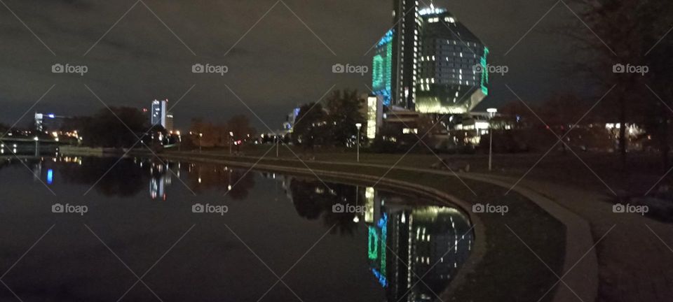 beautiful night light street view, windows magic light, cityscape and reflection in river