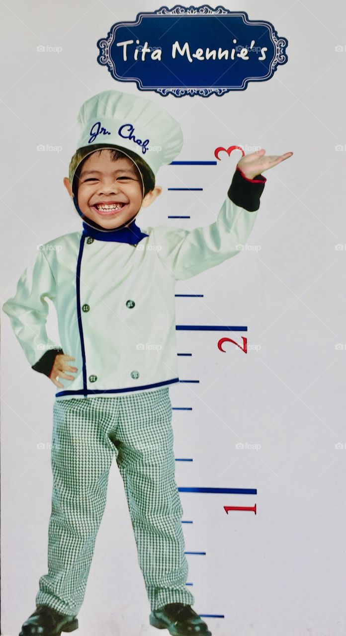 Trying out a standee at the mall. He said that the uniform looks nice but he wanted to be a policeman.