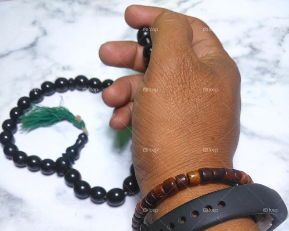 Hand with prayer bead