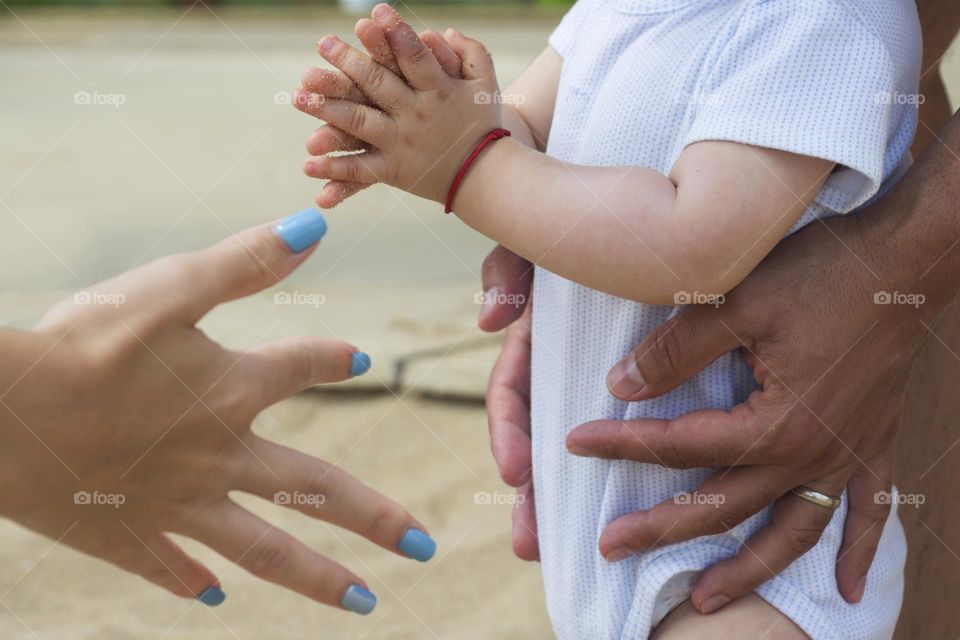 Father holds his little son