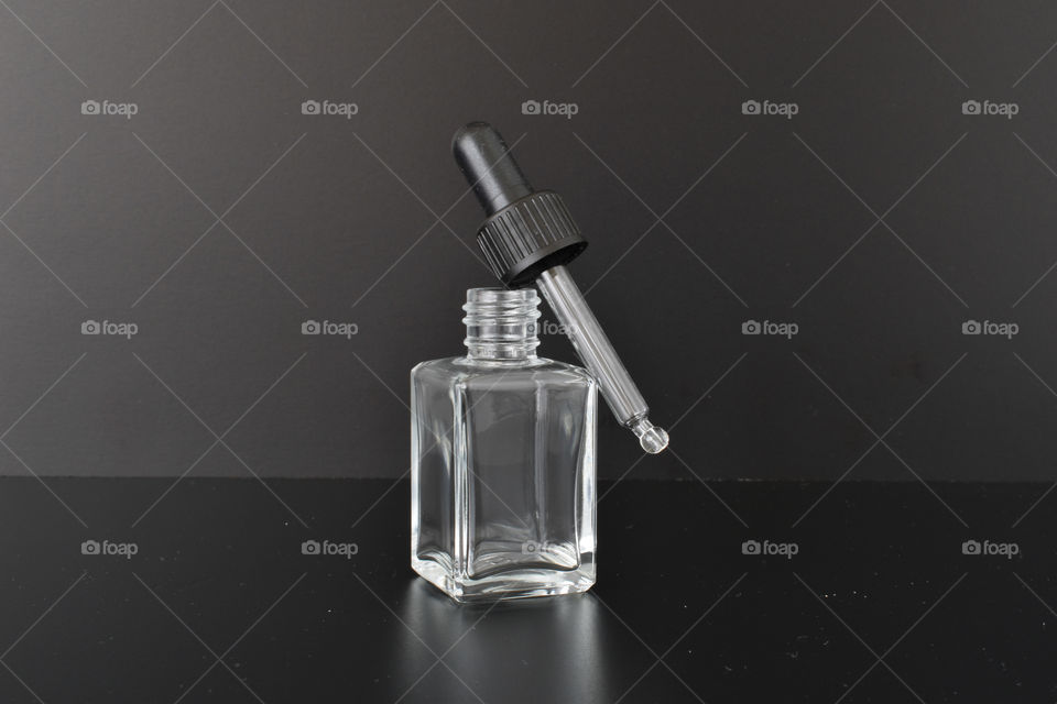 Little Bottle in black background 