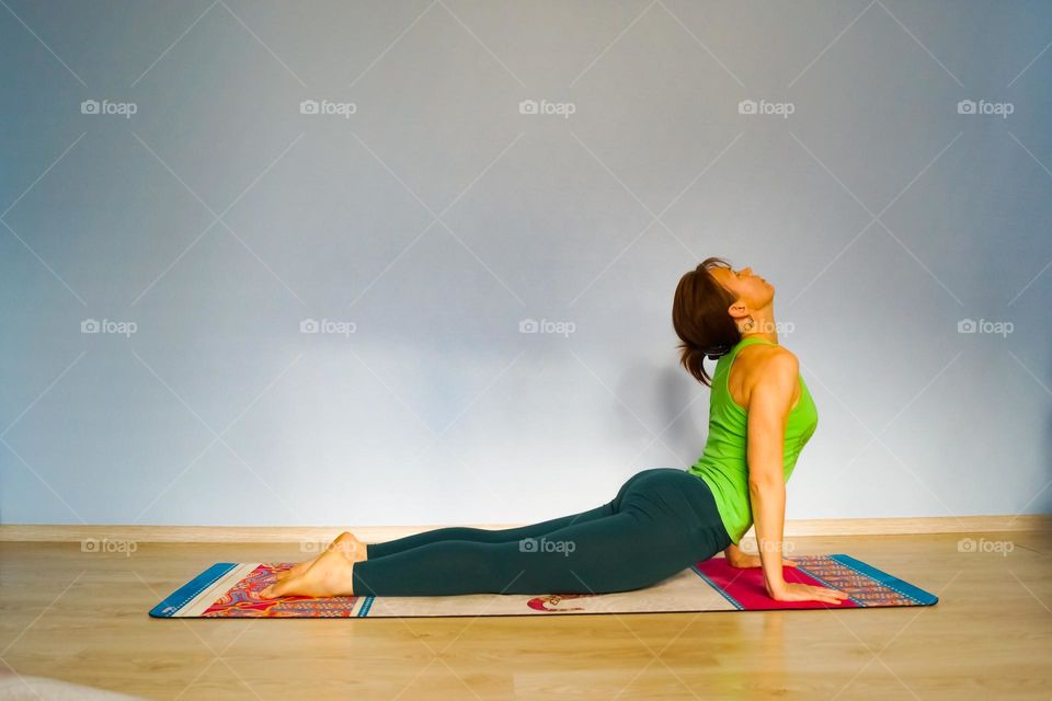 Girl doing yoga in the gym