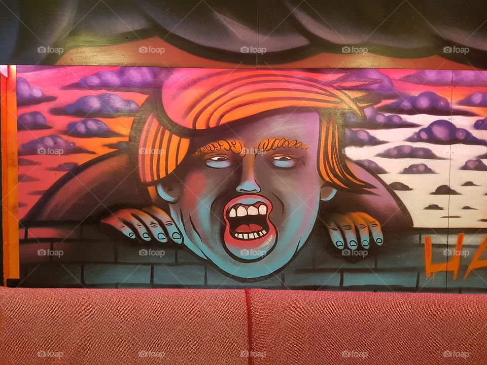 A picture of Donald Trump painted on a wall