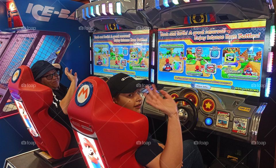 Grandma and grandson playing Super Mario in Casino, UK