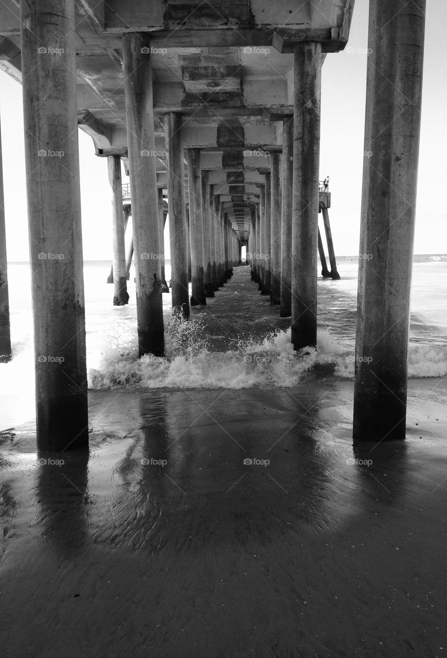 Under the Huntington Beach pier.