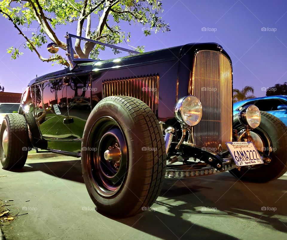 A classic turned into a hot rod lake racer looks striking in the early evening light