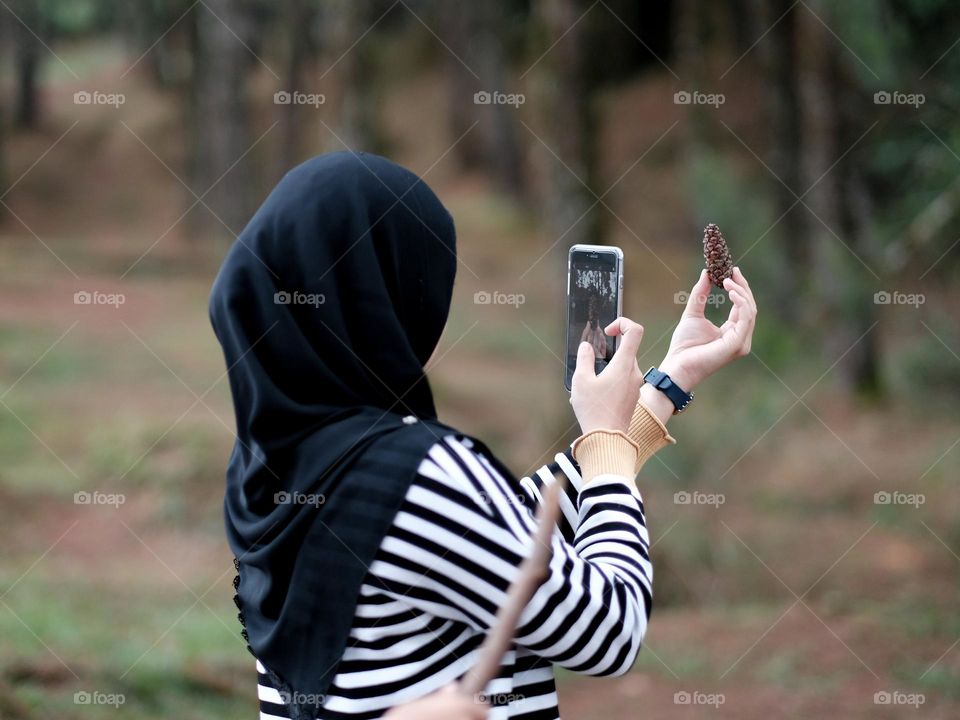 Taking photo with her iphone