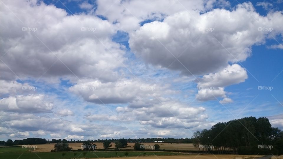 Clouds above fields