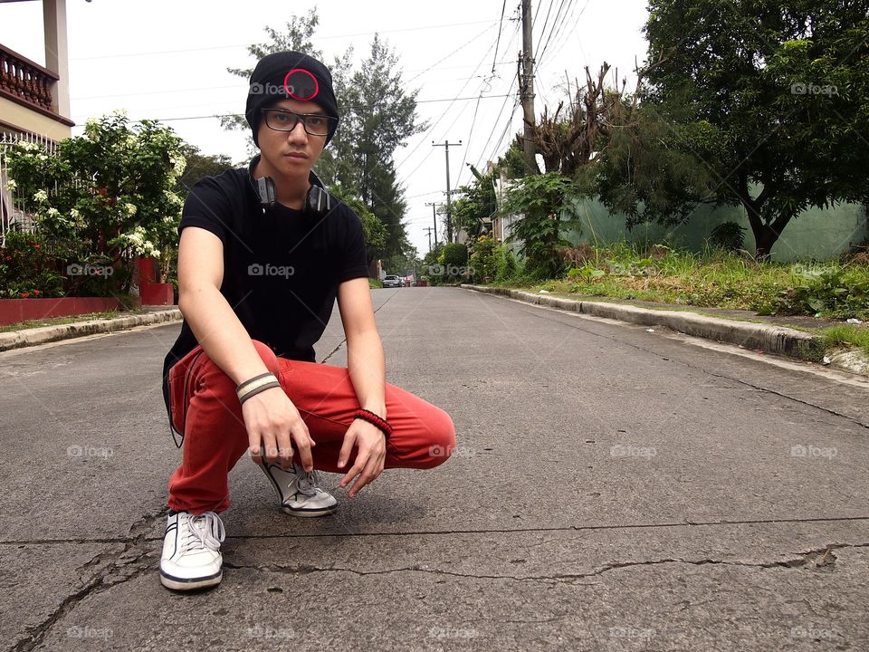 teenage boy wearing bonnet and eyeglasses