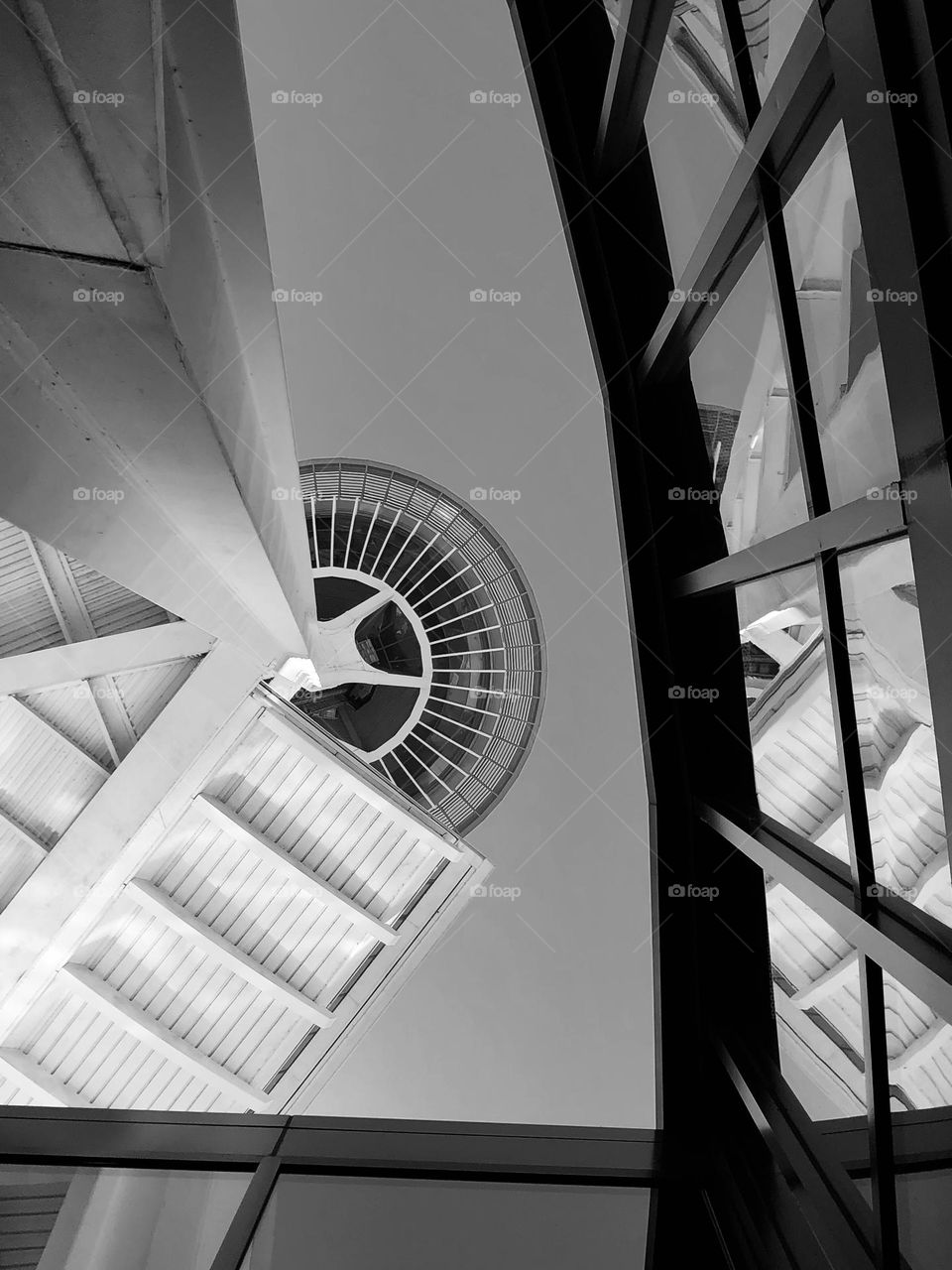 Seattle sky views, looking up from the ground, Seattle Space Needle from the ground, different angles  of architectural structures, reflections and angles in architecture 