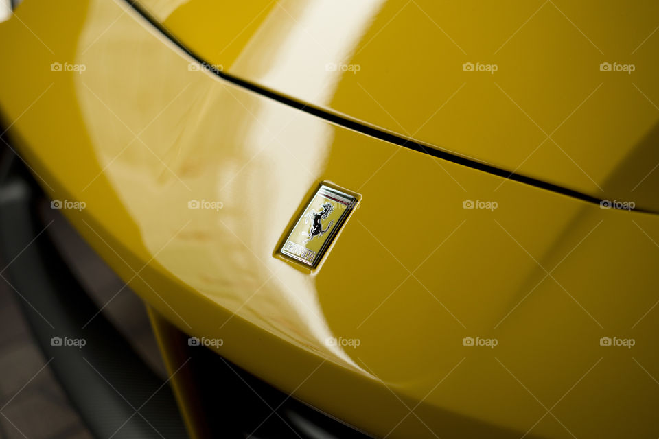 close up logo of Ferrari 488 spider yellow coupe sports car, 3.9 liter V8 twin turbocharged produced by the Italian sports car - Ferrari F154CB V8