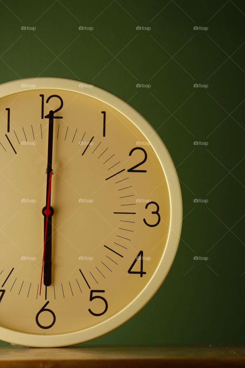 analog clock at six o'clock position