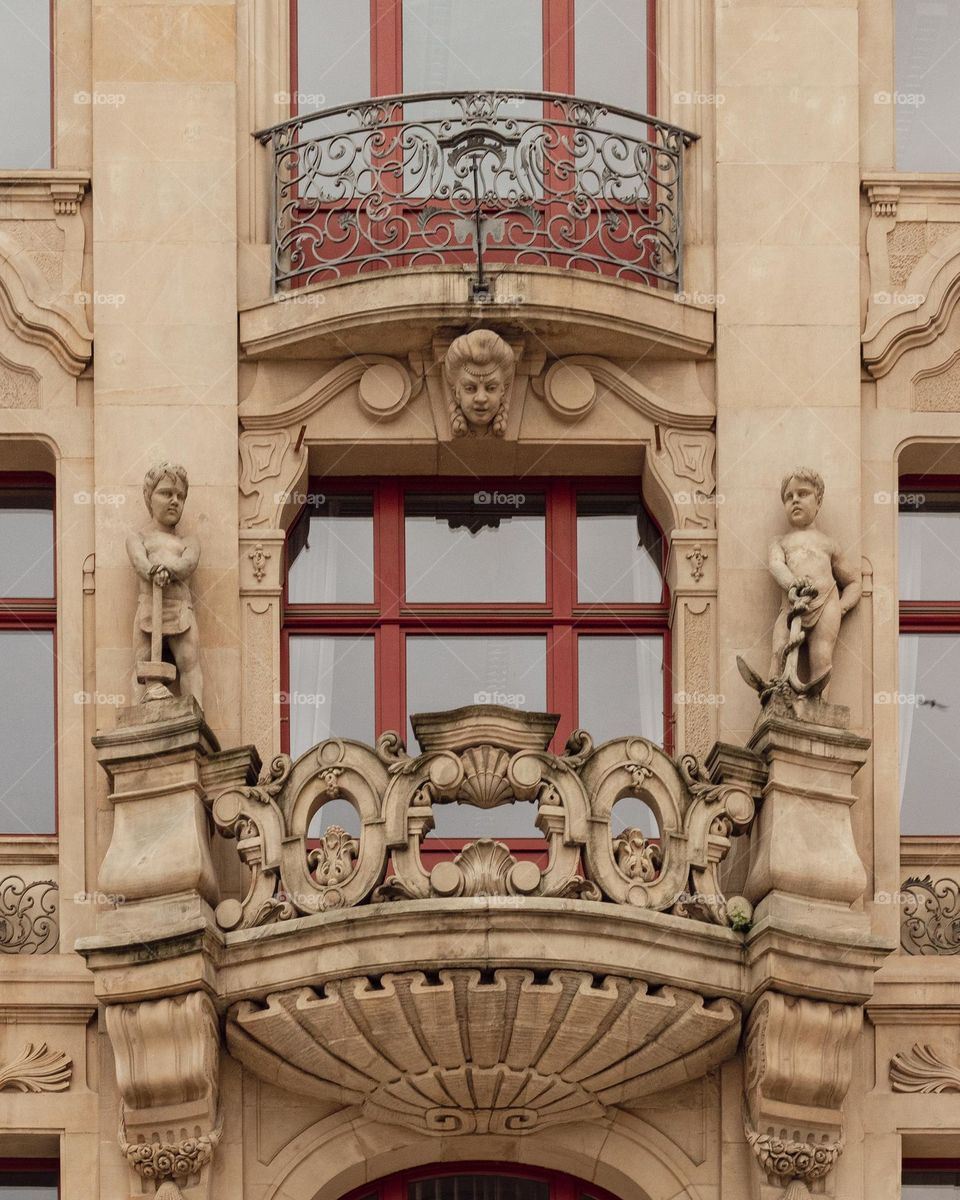 close-up of a fragment of a beautiful facade and a beautifully decorated balcony of a tenement house in Wrocław