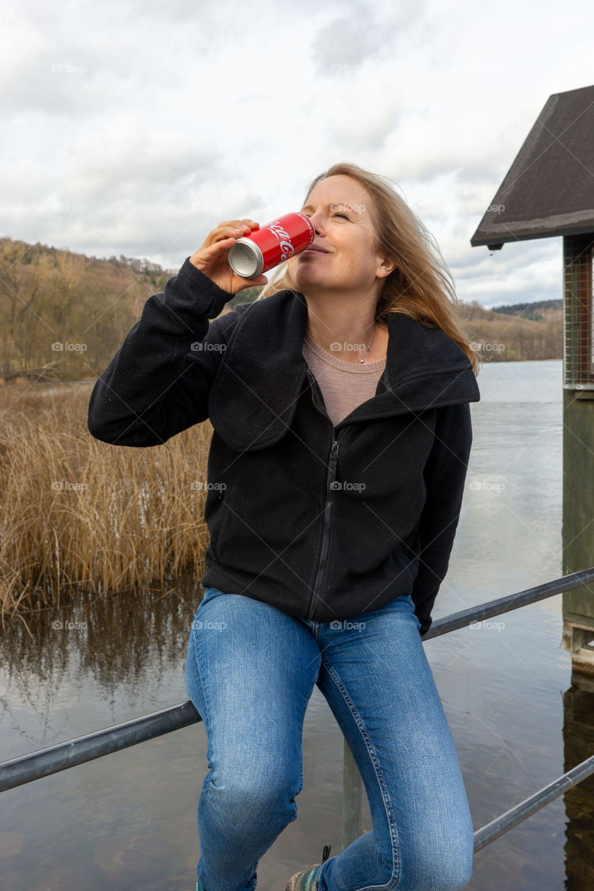 woman drinking Coca Cola