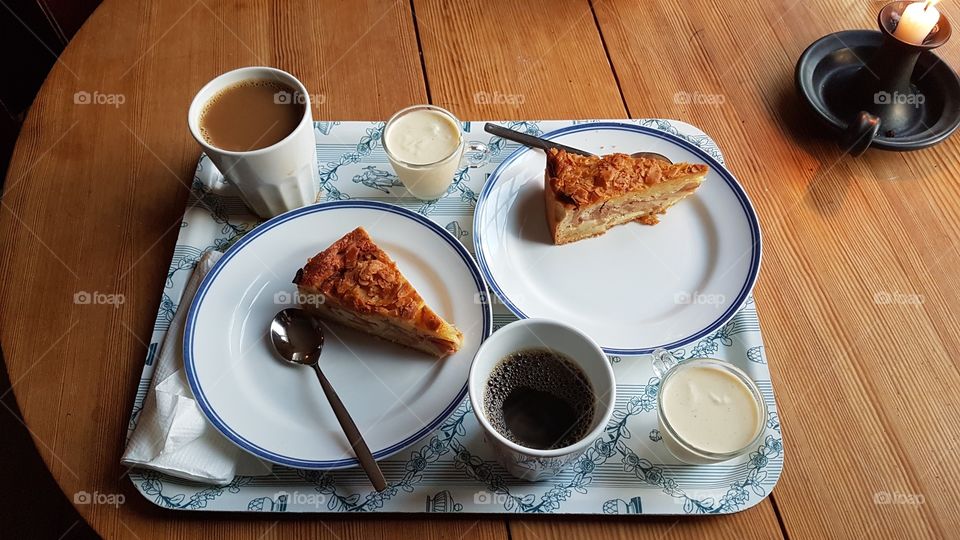 Cup of coffee and apple pie with vanilla sauce on a tray on wooden table - fika vid träbord , kaffe med äppelkaka och vaniljsås på bricka 