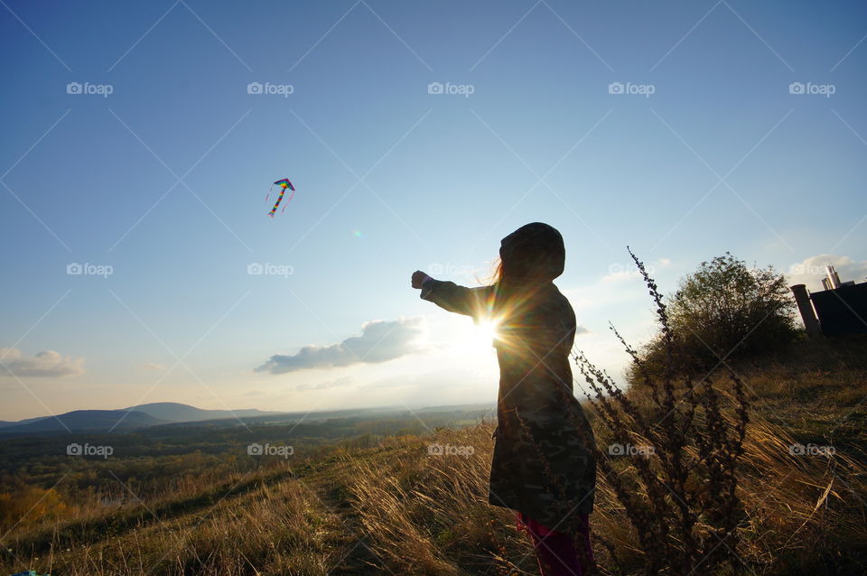 Kite flying in sunset
