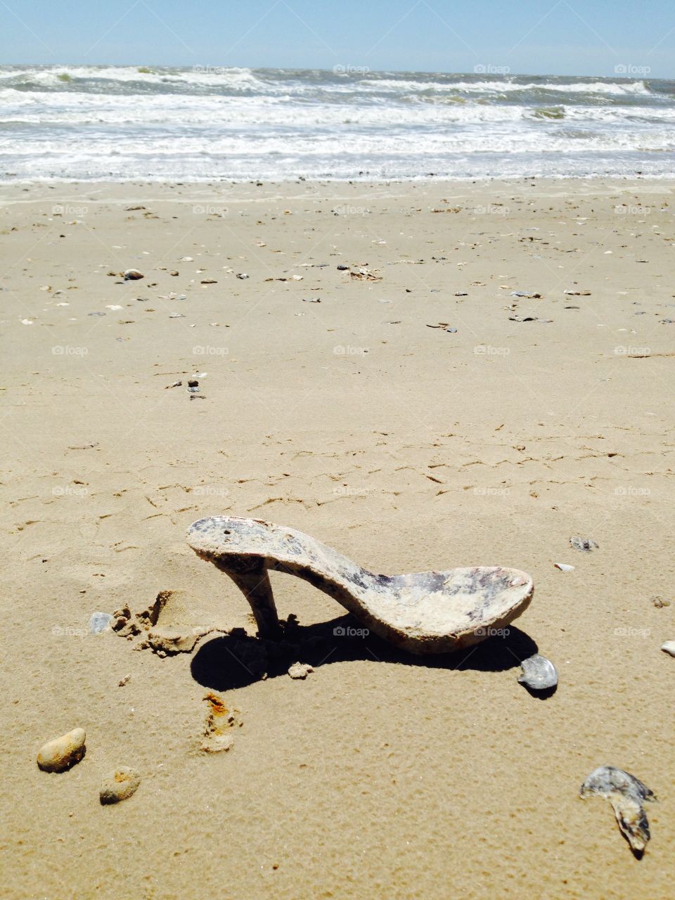 Sand Steppin'. Abandoned high heel shoe on a beach at the Gulf of  Mexico!