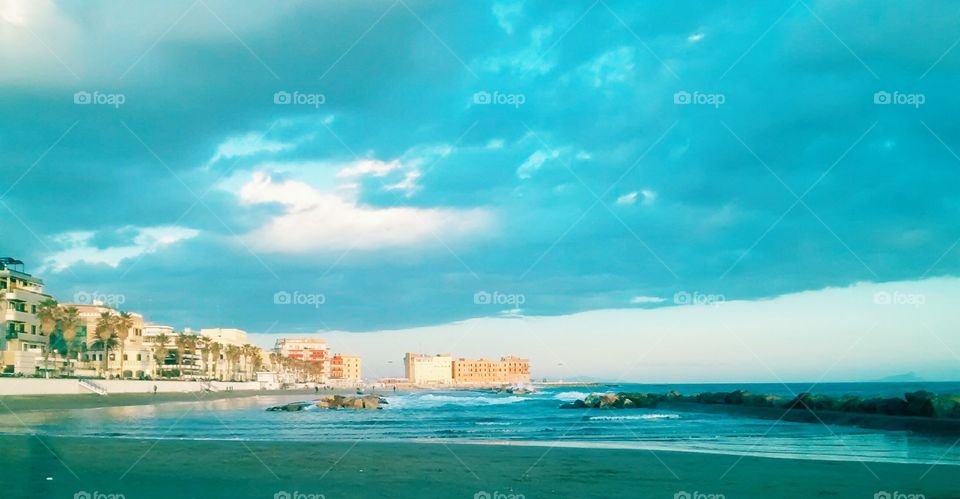 Italian coast. the silence of a winter italian's beach, bright colors and blue dominant