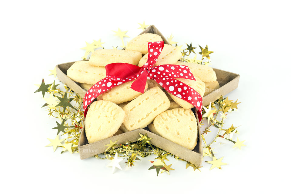 Crisp buttery shortbread in a gift box tied with a red ribbon.  A delicious Christmas  treat.
