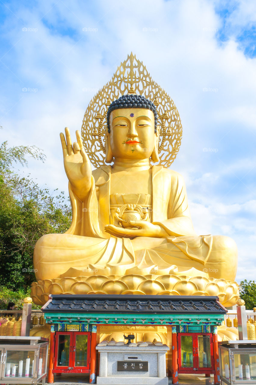 Main Golden Buddha Statue at Sanbanggulsa Temple, Sanbanggulsa is Jeju Islands Most Beautiful Mountain Temple. (Jeju Island, South Korea) Selective Focus