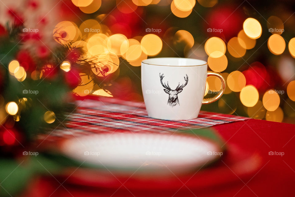 cup of coffee in a cozy festive Christmas atmosphere