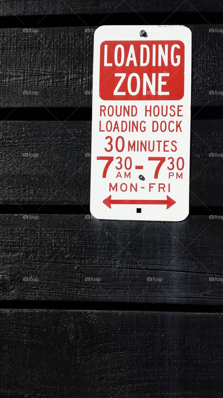 Loading zone signage . Image acquired in New South Wales, Australia 