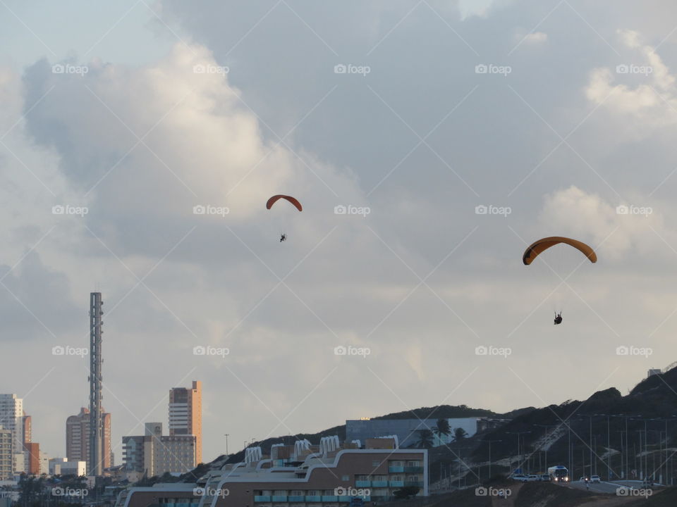 parachutes fly city