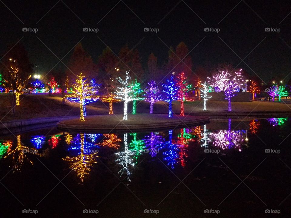 LED lights reflected in pond Viturian Park