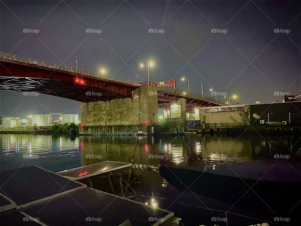 The „Pulaski Bridge“ at „Newtown Creek“ connects „Greenpoint“, Bklyn with LIC, Queens, NY. Tonight on the eve of „July 4th, 2022“ fireworks were launched from the „East River“ and many festive get togethers were held. Hypnotic Productions