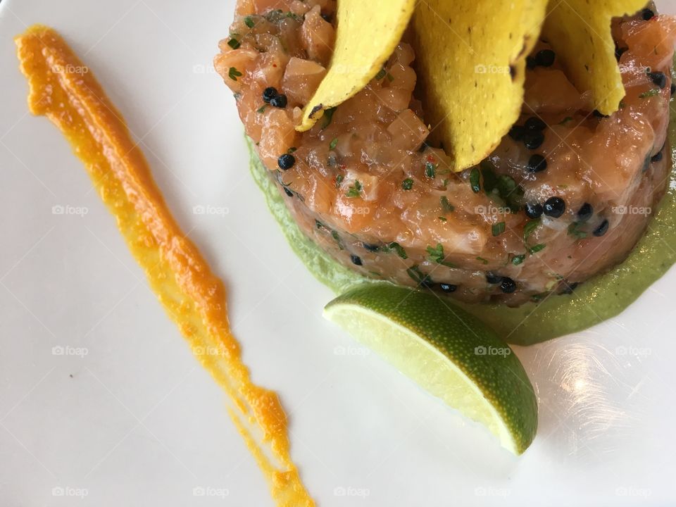 Salmon tartare with orange pepper purée 