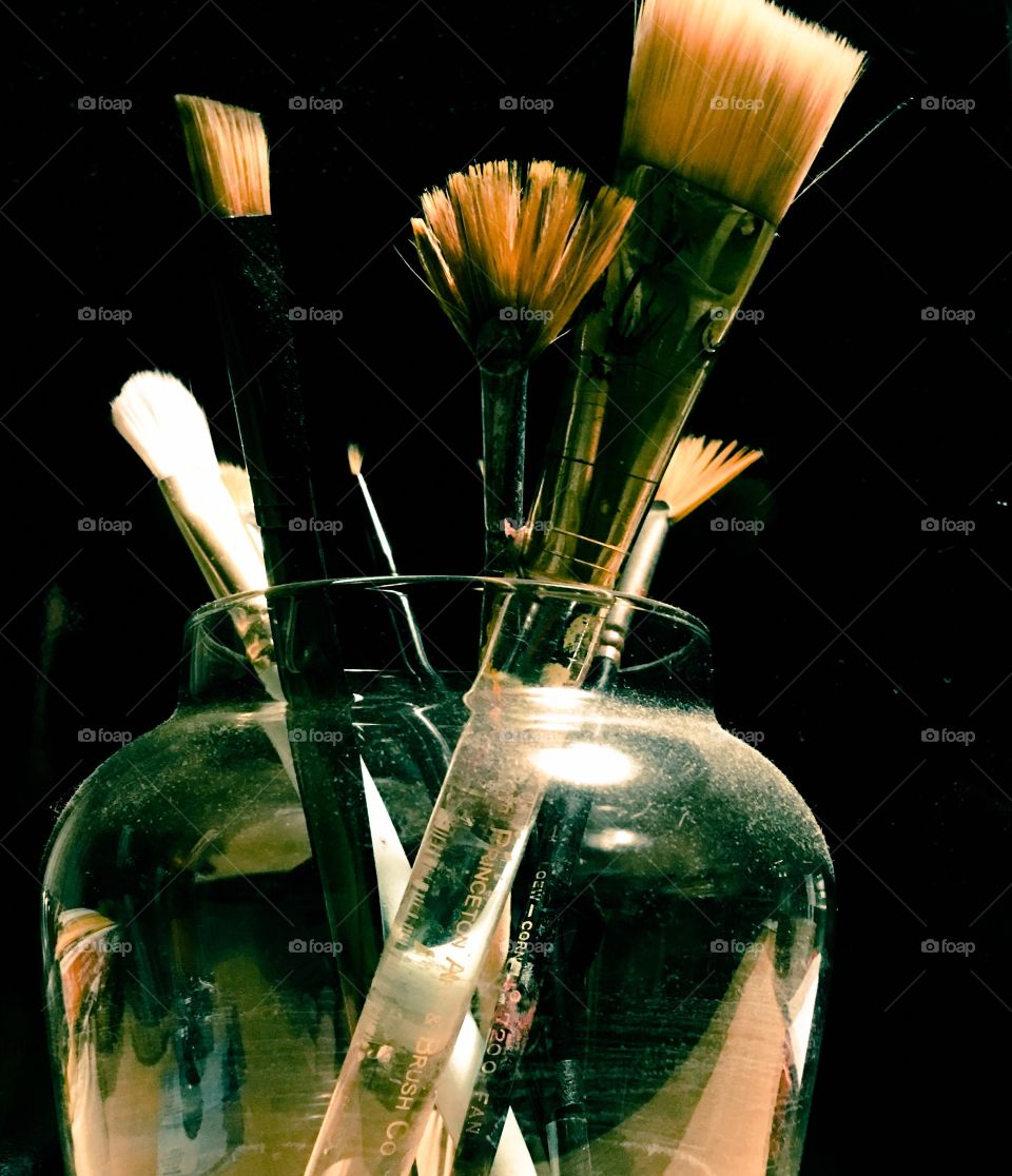 Paint brushes in a jar