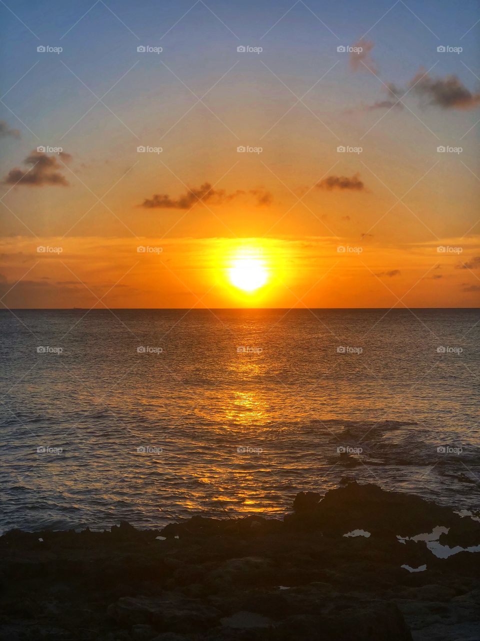 Sun setting over the water